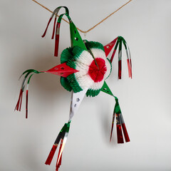 Traditional mexican piñata with red, green an red color