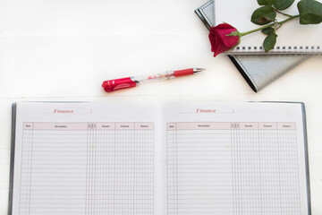 accounting book with notebook for business work arrangement flat lay style on background white 