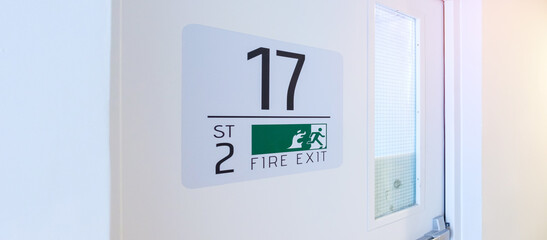 Fire Exit door sign for emergency. Stairwell fire for escape in building or apartment