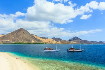 Foto op Canvas Panorama view of beaches and tourist boat sailing in Kelor Island, Flores Island, Indonesia © Yusnizam Yusof