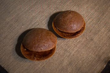 Round organic palm sugar traditionally processed by rural communities in Indonesia, photographed in the kitchen of one of the villagers
