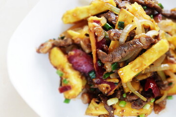 Chinese food, sweet potato and beef stir fried for winter vegetable comfort food