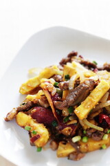Chinese food, sweet potato and beef stir fried for winter vegetable comfort food