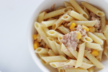Homemade penne short pasta and tuna with sweet corn salad