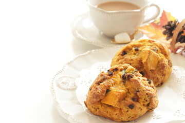 Homemade pumpkin scone and milk tea  for autumn breakfast food image 