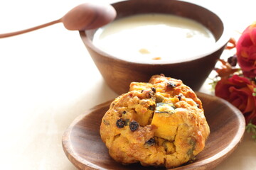 Homemade pumpkin scone and clam chowder for autumn breakfast 