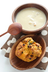 Homemade pumpkin scone and clam chowder for autumn breakfast 