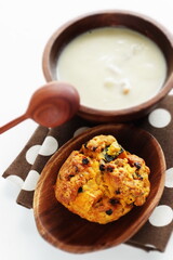Homemade pumpkin scone and clam chowder for autumn breakfast 