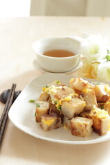Chinese food, turnip cake and egg stir fried with green onion 