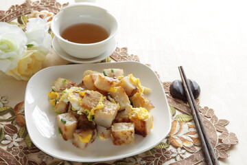 Chinese food, turnip cake and egg stir fried with green onion 