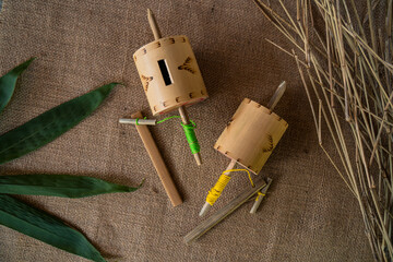Details of some traditional Indonesian children's toys in the past, made of bamboo pieces that are...