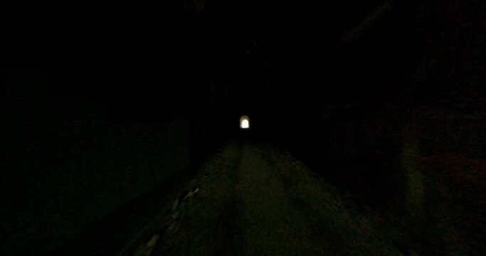 FPV drone flying through gold mine tunnel and railroad in Montana