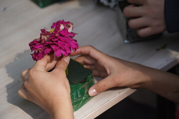 Florists teach children to collect flower arrangements