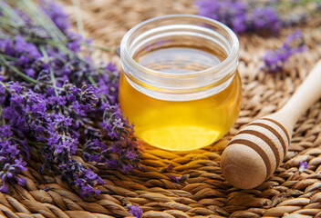 Jar with honey and fresh lavender flowers