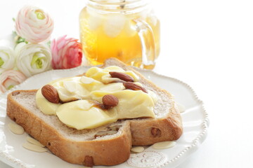 Japanese cafe food, pudding and almond on toast for sweet breakfast and dessert with iced jar tea