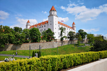 Fototapeta na wymiar The majestic white-glowing Bratislava Castle on a sunny spring day.
