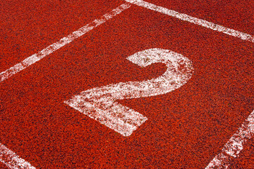 The number 2 at start point of running track