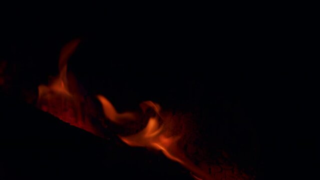 Burning hot embers of a wood fire. Solid fuel stoves now classed as a renewable power source. Close up.