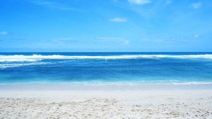 Fototapeta na wymiar Beautiful beach with blue sea water and clear sky background