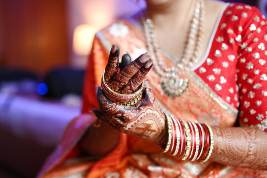 Indian Bride showing Mehndi Design with Bangles                  