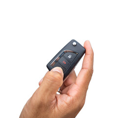 Fototapeta premium Hand pressing the button on the remote to lock or unlock the car with the remote control.