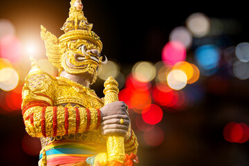Giant statue of God, Thao Wessuwan magical at the Thai temple on bokeh background