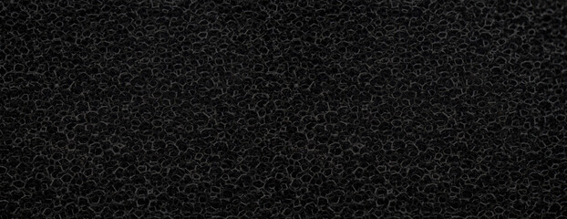 banner of macro black polyurethane foam rubber washcloth sponge - obrazy, fototapety, plakaty