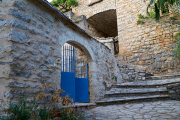 metallic classic blue steel vintage metal arch stone house gate access property in medieval city