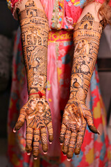  Indian bride showing her mehndi design
