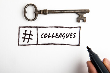 Colleagues. Old door key and hashtag symbol on white background