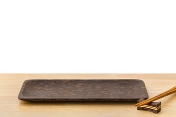 Empty sushi bamboo tray board on wood table white background. Bamboo products that have been processed into trays for use in the kitchen. Top view of plank wood for graphic stand design product.