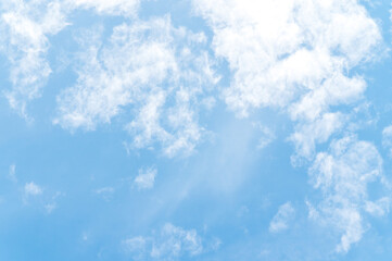 Beautiful white fluffy clouds in blue sky. Nature background from white clouds in sunny day