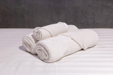 Fototapeta na wymiar stack of white towel on bedroom