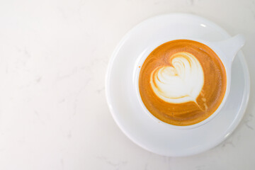 top view latte art in a cup that on white table