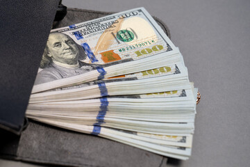 American dollar banknotes stack, pack of money in black bag, rich, luxury, currency, spending money in crisis, benchmark currency, most used in transactions across the world, corruption  