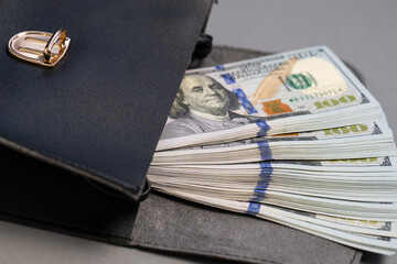 American dollar banknotes stack, pack of money in black bag, rich, luxury, currency, spending money in crisis, benchmark currency, most used in transactions across the world, corruption  