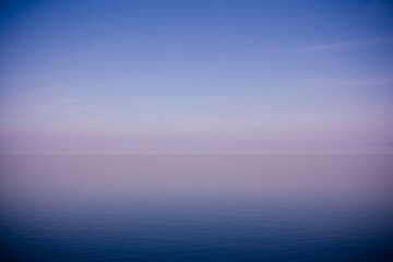 sky and calm sea  blue lilac background ocean