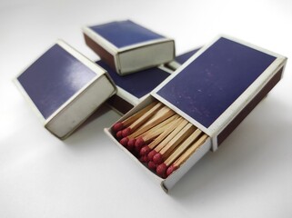 Wooden matches in a box isolated on a white background