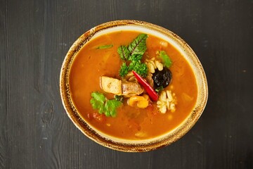 Soup with beef, nuts and prunes. Food from the chef in a restaurant or cafe.