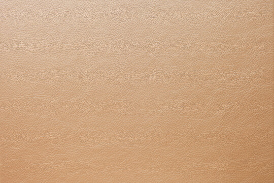 Abstract luxury gold-beige leather texture for background. Color leather for work design or backdrop product.