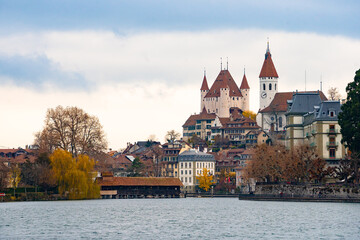 Thun castle , museum and Swiss heritage site in old town of Thun , Aare lake during autumn , winter cloudy day : Thun , Switzerland : December 2 , 2019