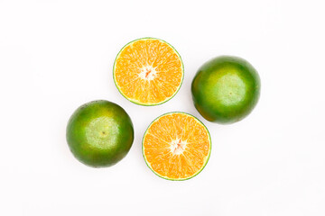 fresh orange fruits and slices isolated on a white background