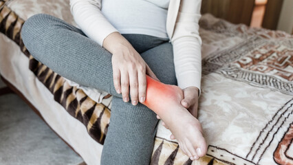 Pregnancy pain leg woman. Pregnant girl have leg disease, ankle pain doing health massage exercise. Foot swelling during pregnancy.