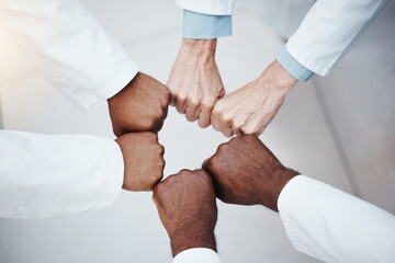 Doctors fist bump in teamwork motivation and solidarity hands sign for commitment, motivation or...