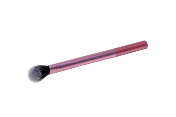 Makeup brushes. Selective focus on an elegant pink professional make-up brush isolated on a white background. Concept beauty. Macro.