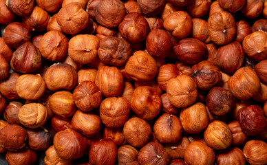 Heap of hazelnuts close-up. Peeled nuts. Hazelnut isolated on white background.