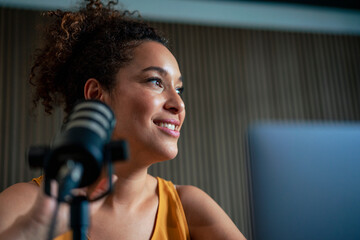 Thoughtful mature radio presenter in recording studio