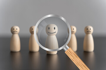 HRM or Human Resource Management, Magnifier glass focus to manager icon which is among staff icons