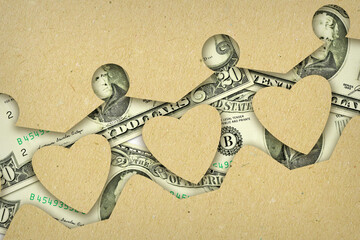 Paper people chain made with dollar banknotes- Concept of economic and financial assistance