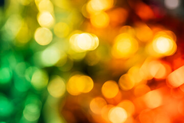 Obraz premium Blurred bokeh background for Christmas and New Year holiday. Abstract colorful wallpaper with defocused lights. Copy space